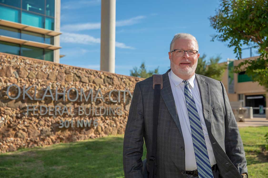 Photo of attorney Gary Jones in front of Oklahoma City Federal Building